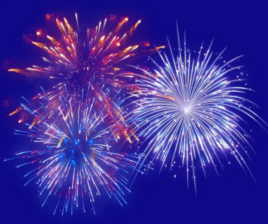 Red, white, and blue fireworks on a deep purple background