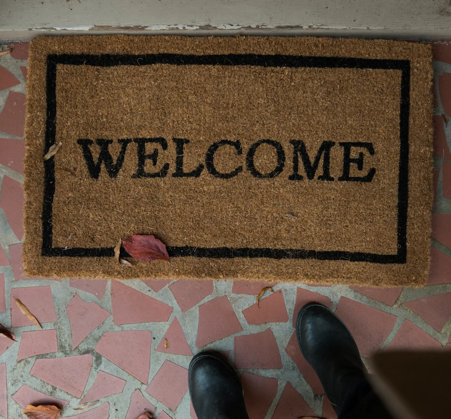 A Welcome Mat indicates that women & their children find a welcome environment at WSTC's Fuller House