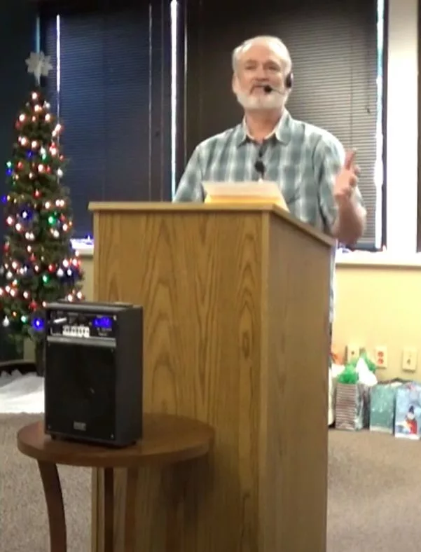 Ken Wilson speaks at the staff holiday party