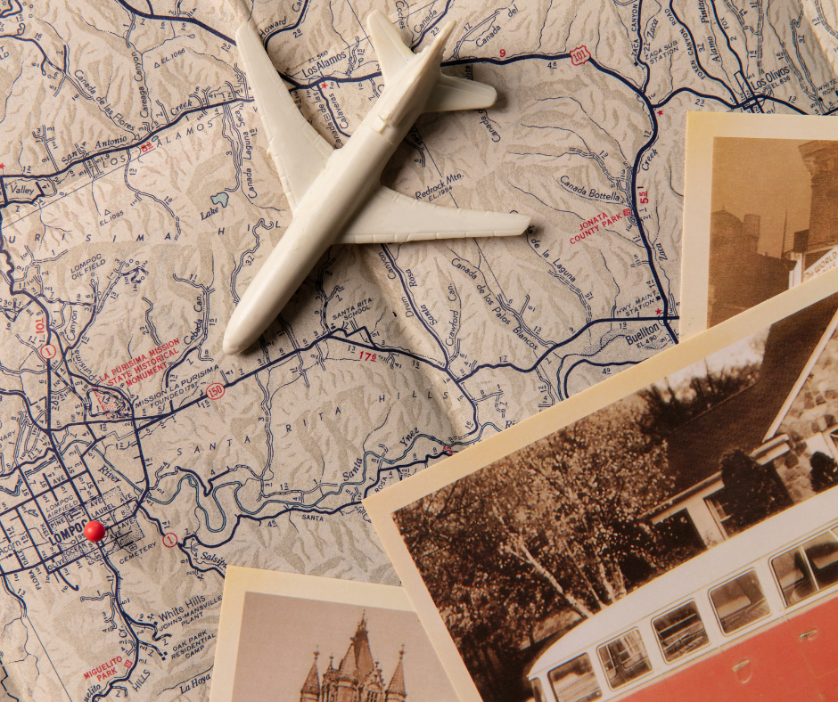 A plastic plane and some vintage looking photos sit on top of a map of Lompoc